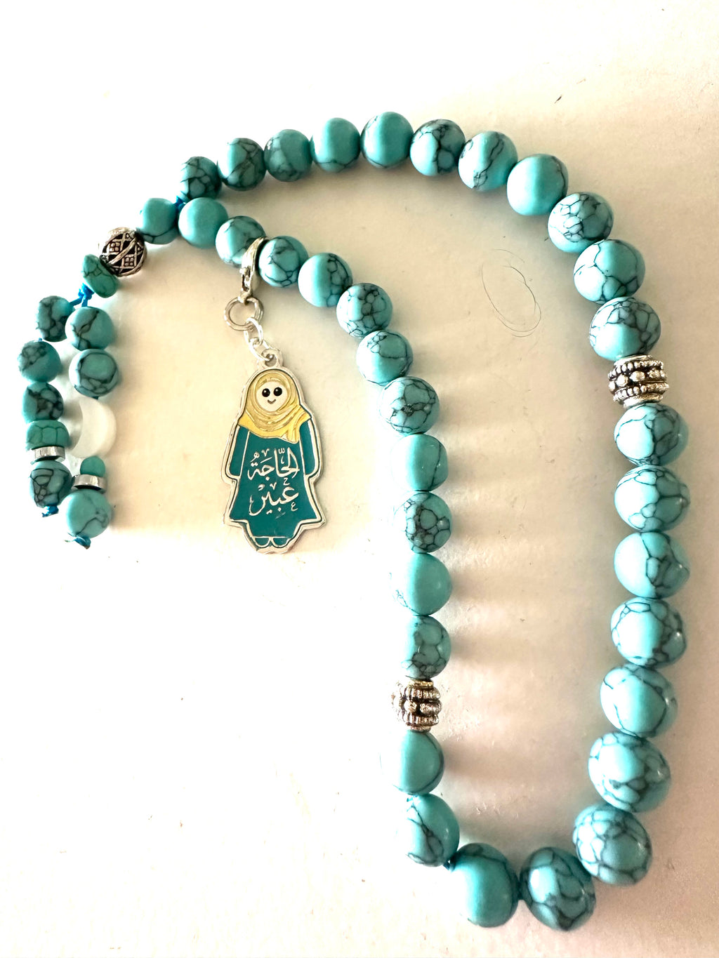 HAGA ABEER  TURQUOISE ABAYA CLIP.