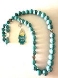 HAGA ABEER  TURQUOISE ABAYA CLIP.