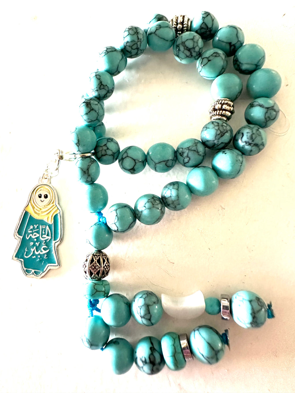 HAGA ABEER  TURQUOISE ABAYA CLIP.