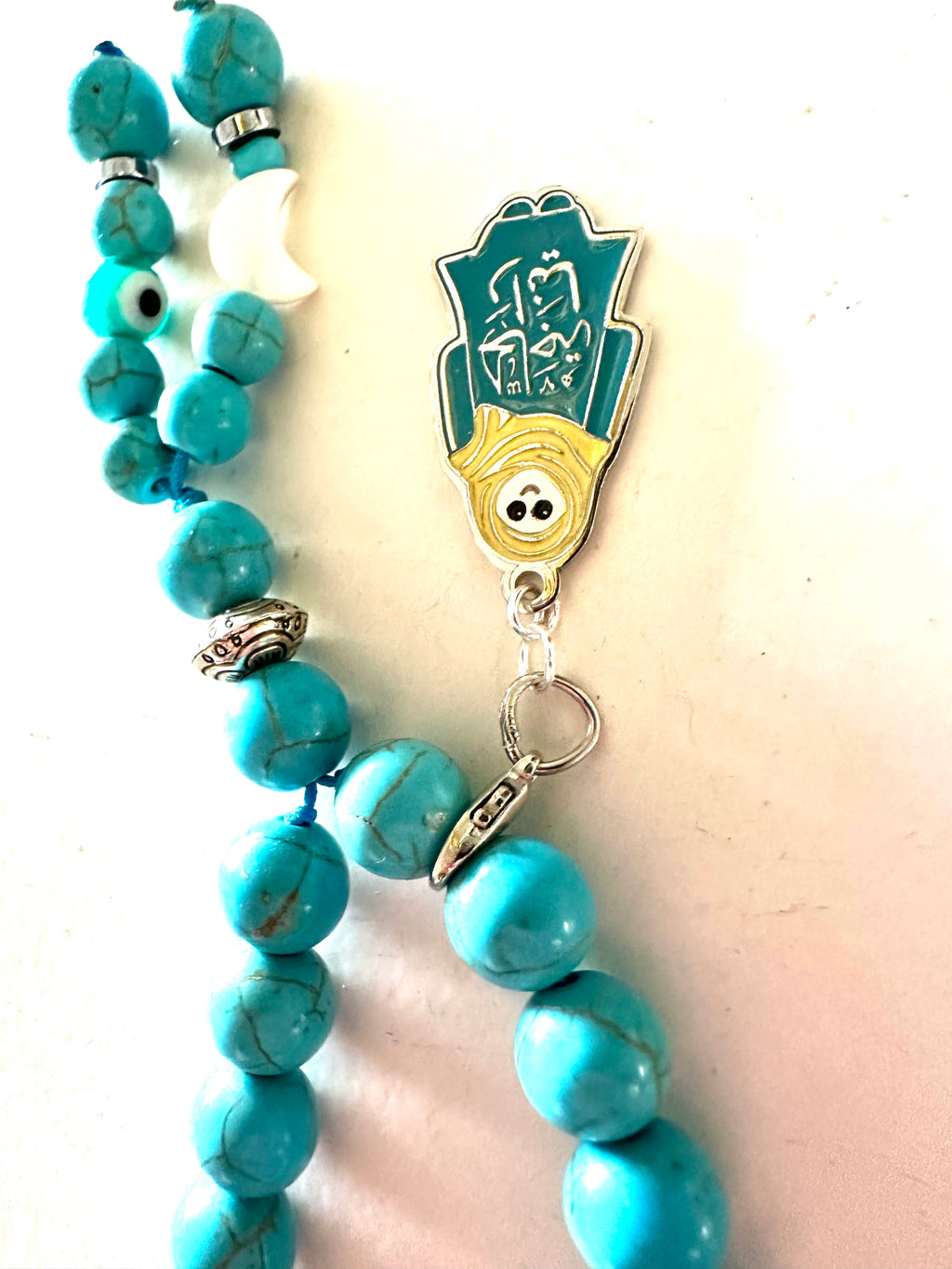 HAGA RANIA TURQUOISE ABAYA CLIP.