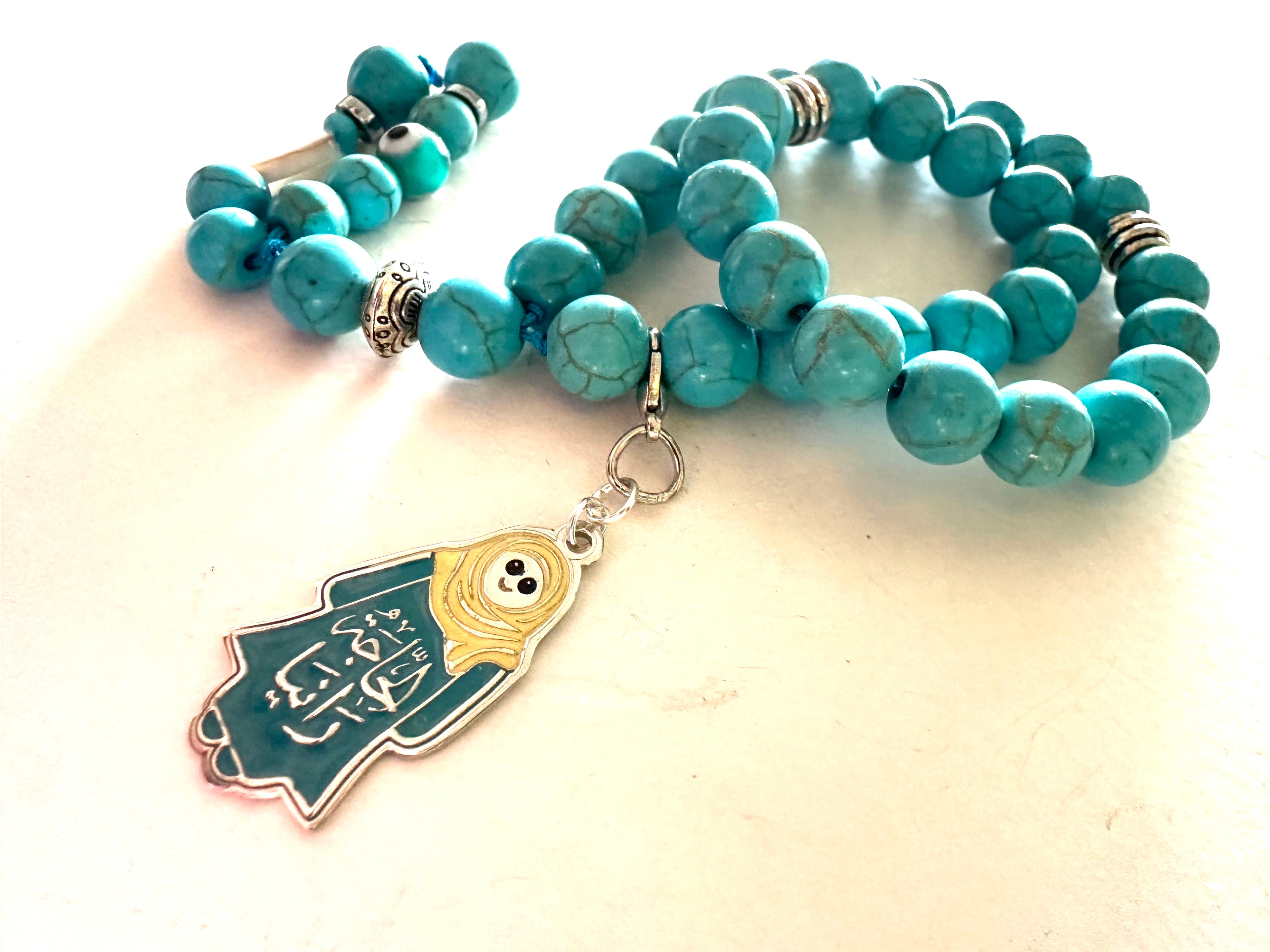 HAGA RANIA TURQUOISE ABAYA CLIP.